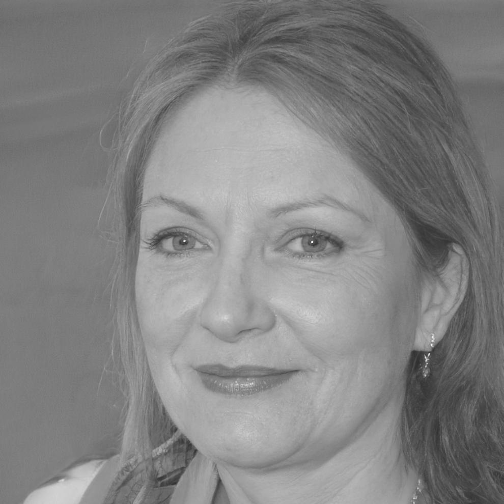 Professional woman working on blockchain insurance development at modern workstation